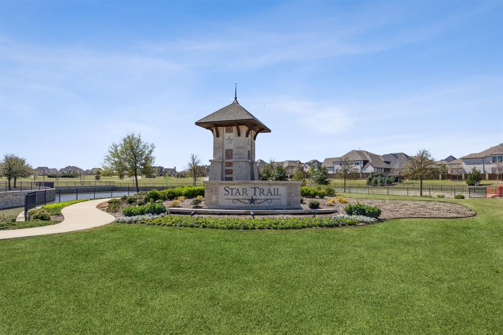 Tbd Legacy Drive Prosper, TX 75078 - Photo 16 of 16 a view of a lake with a house in the background