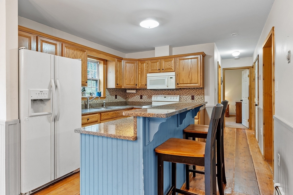 32 East Rindge Road Ashburnham, MA 01430 - Photo 5 of 31 a kitchen with stainless steel appliances granite countertop sink stove and refrigerator