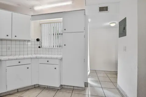 a view of cabinets with wooden floor