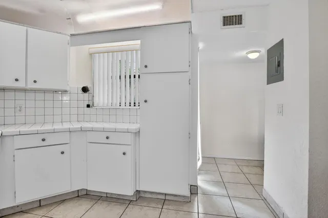 a view of cabinets with wooden floor
