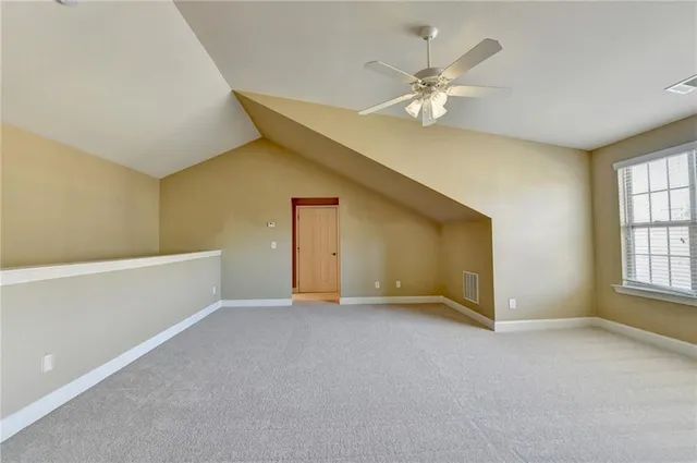 a view of a balcony with wooden floor and staircase
