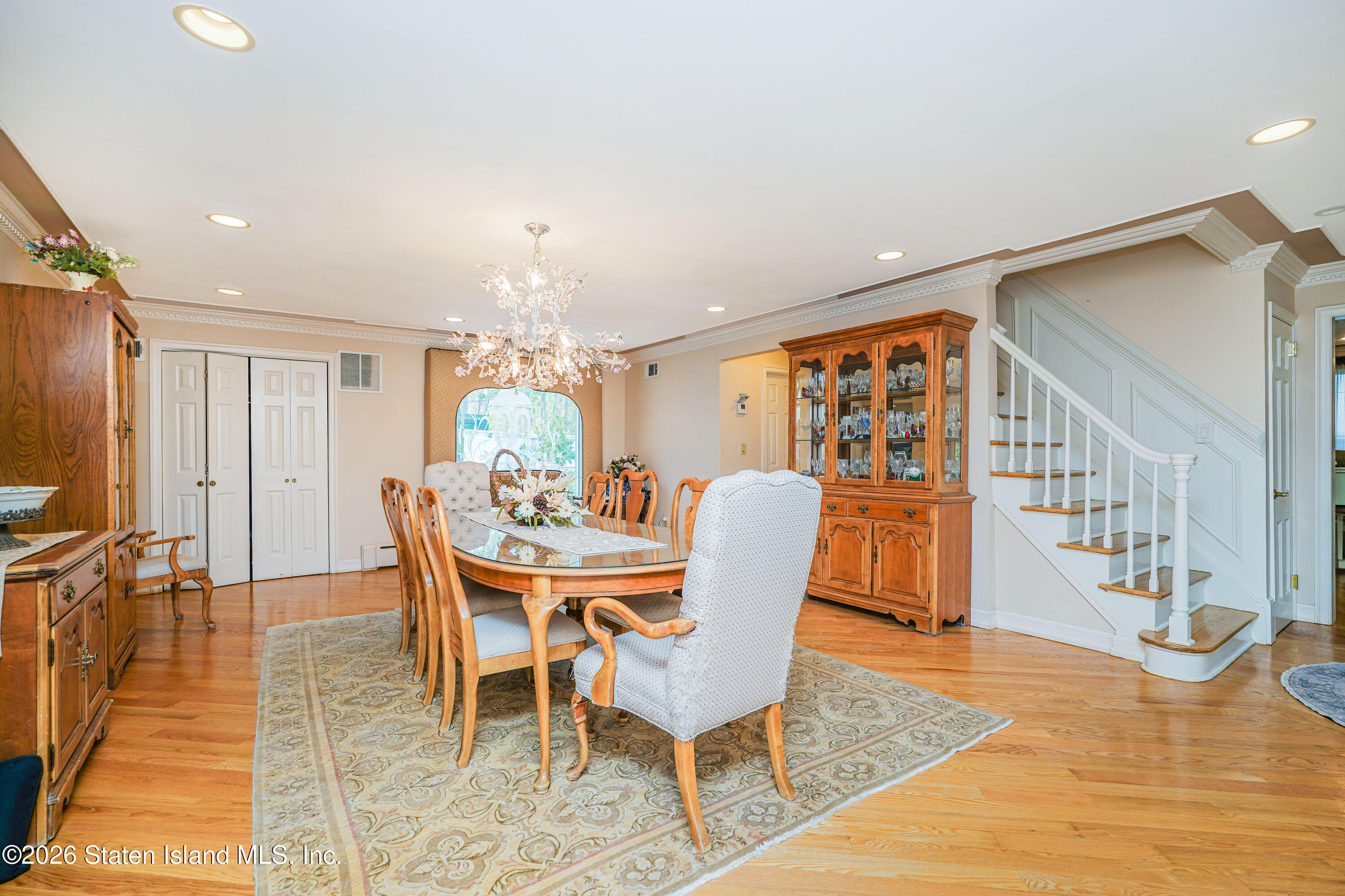 26 Highpoint Road Staten Island, NY 10304 - Photo 12 of 49 a dining room with furniture a rug and wooden floor