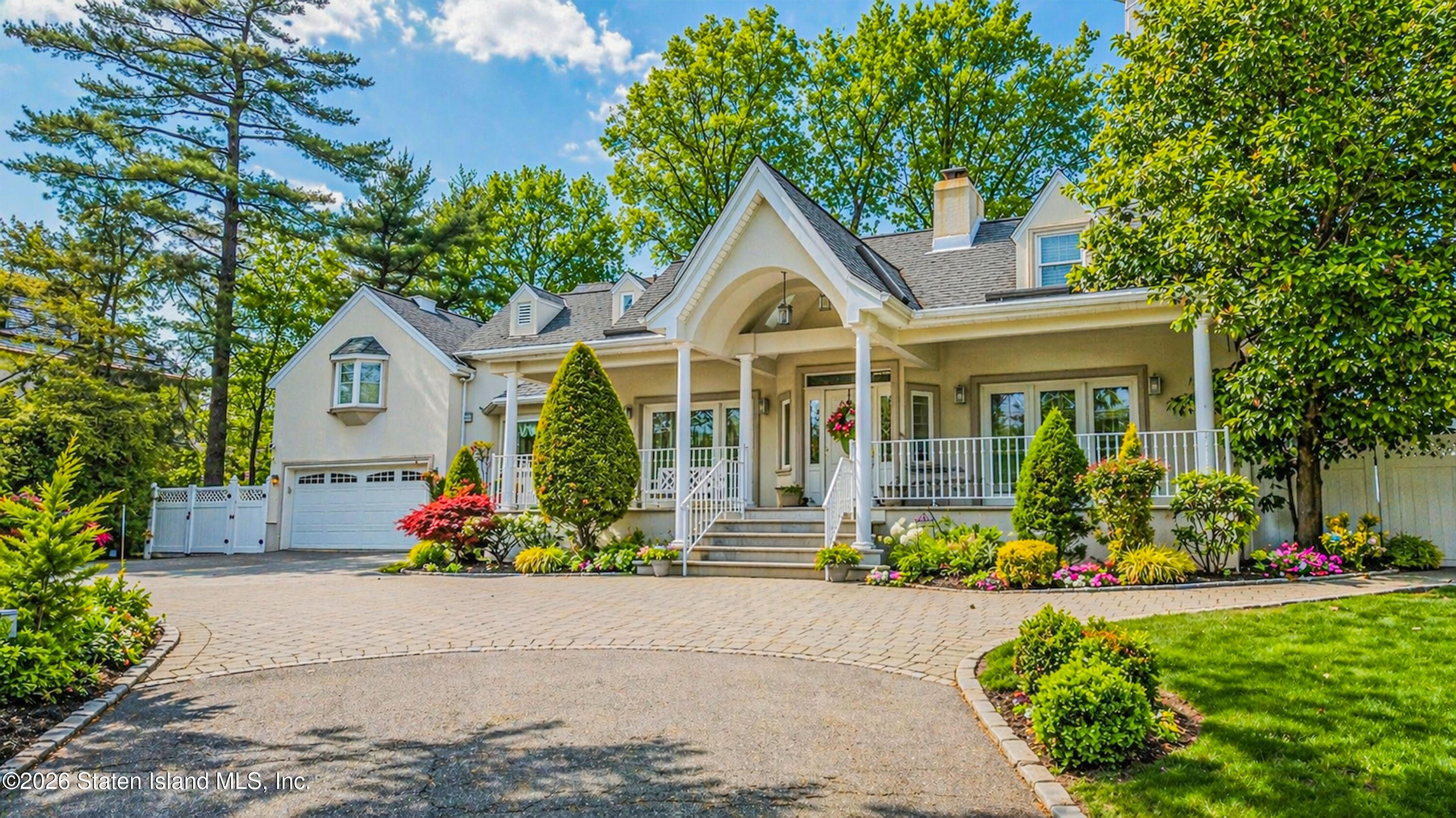 26 Highpoint Road Staten Island, NY 10304 - Photo 2 of 49 a front view of a house with a yard and potted plants