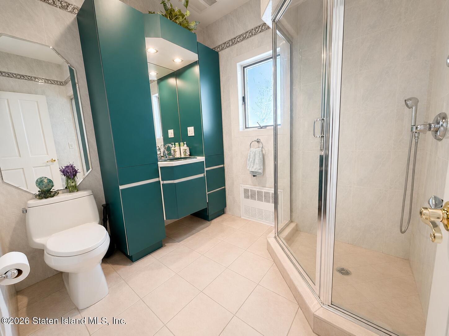 26 Highpoint Road Staten Island, NY 10304 - Photo 21 of 49 a bathroom with a sink toilet and shower