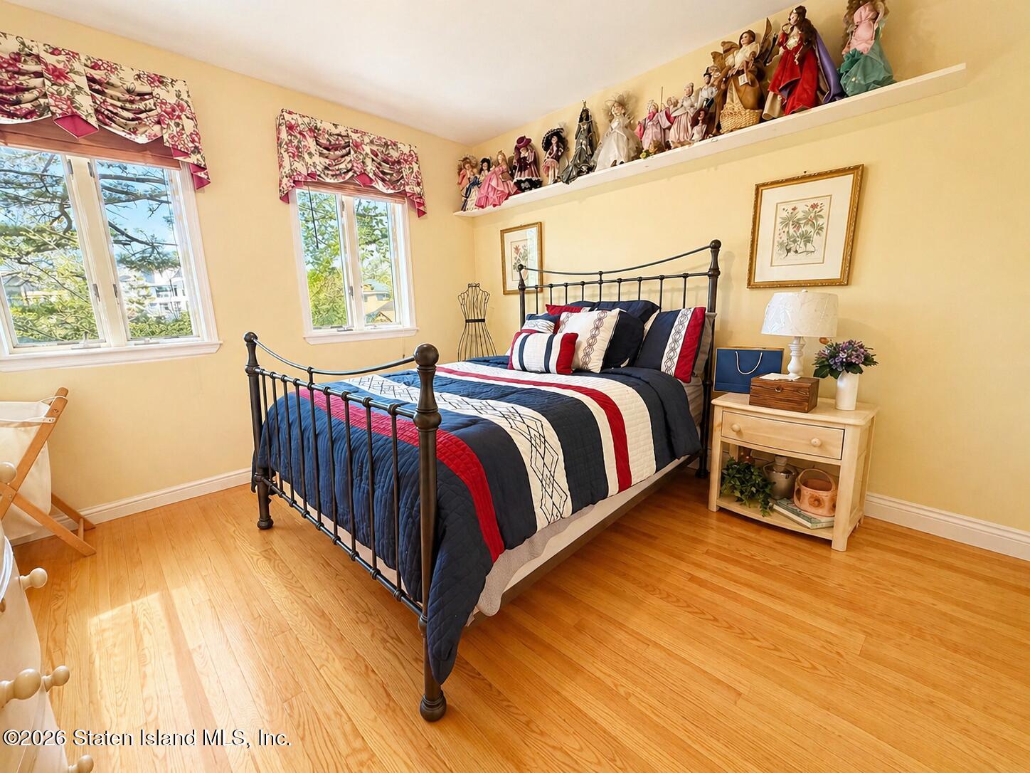 26 Highpoint Road Staten Island, NY 10304 - Photo 25 of 49 a bed room with a bed and a chair