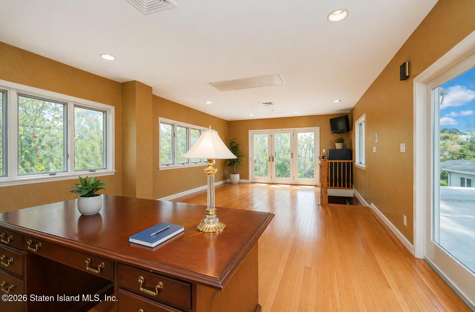 26 Highpoint Road Staten Island, NY 10304 - Photo 29 of 49 a view of a dining room with furniture a chandelier and wooden floor