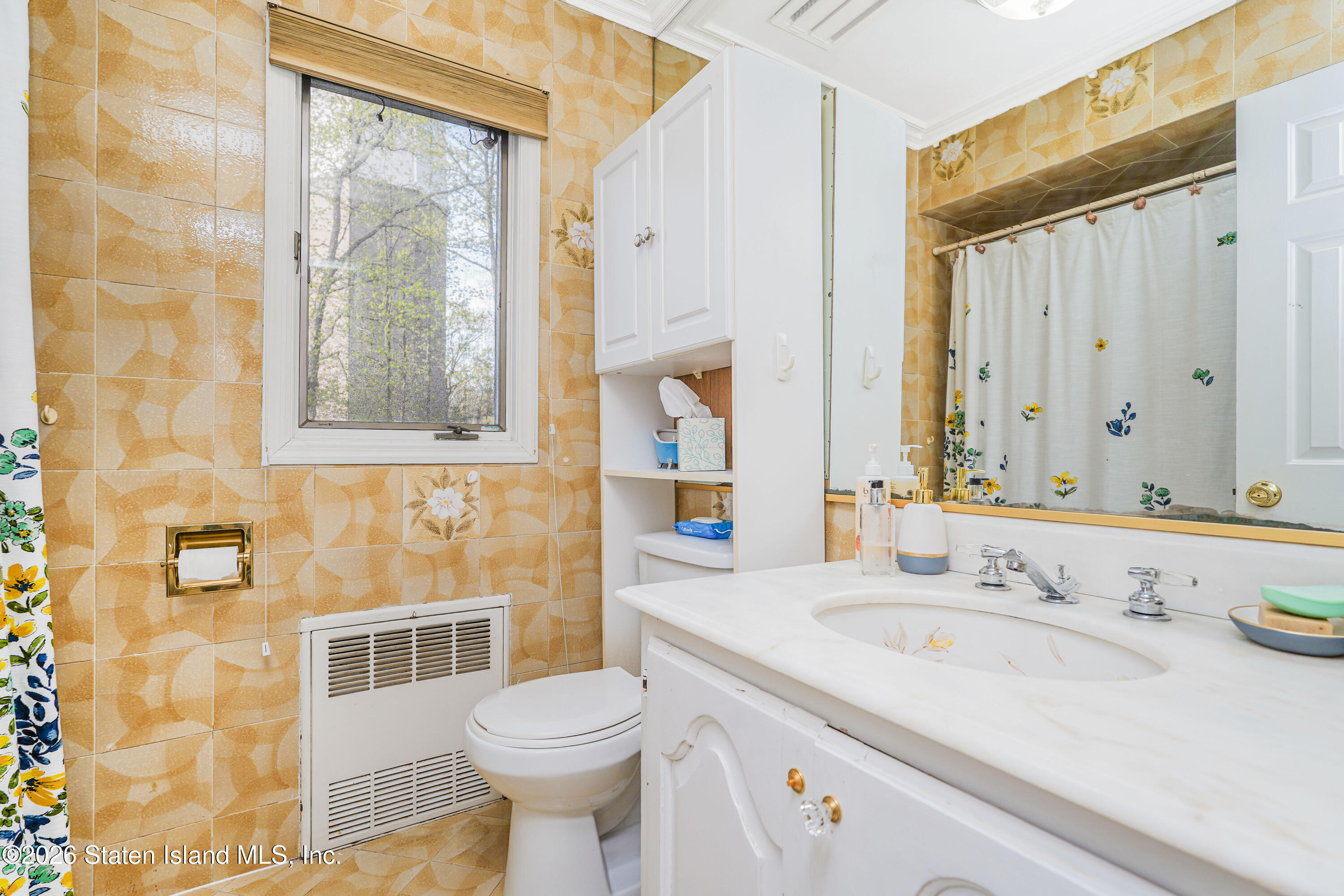 26 Highpoint Road Staten Island, NY 10304 - Photo 32 of 49 a bathroom with a sink toilet and shower