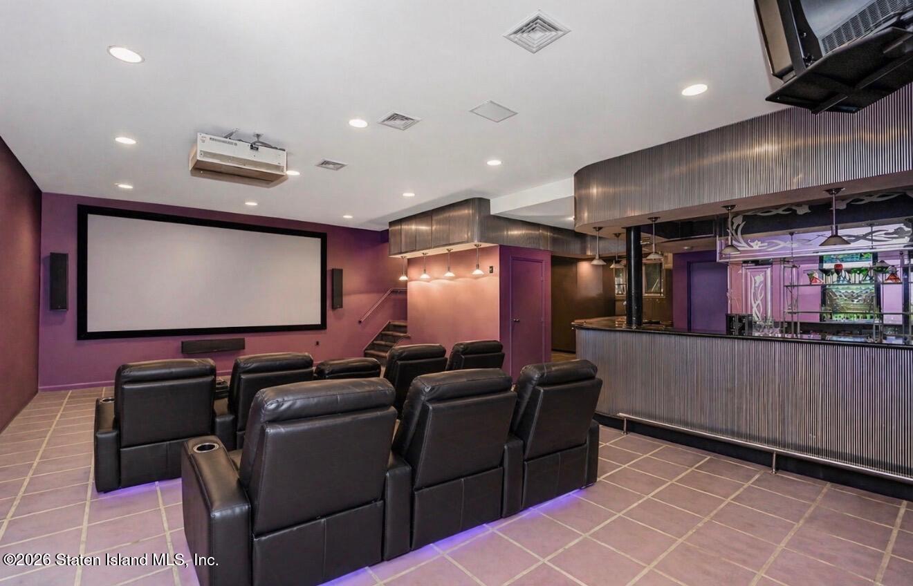 26 Highpoint Road Staten Island, NY 10304 - Photo 35 of 49 a media room with lots of chairs