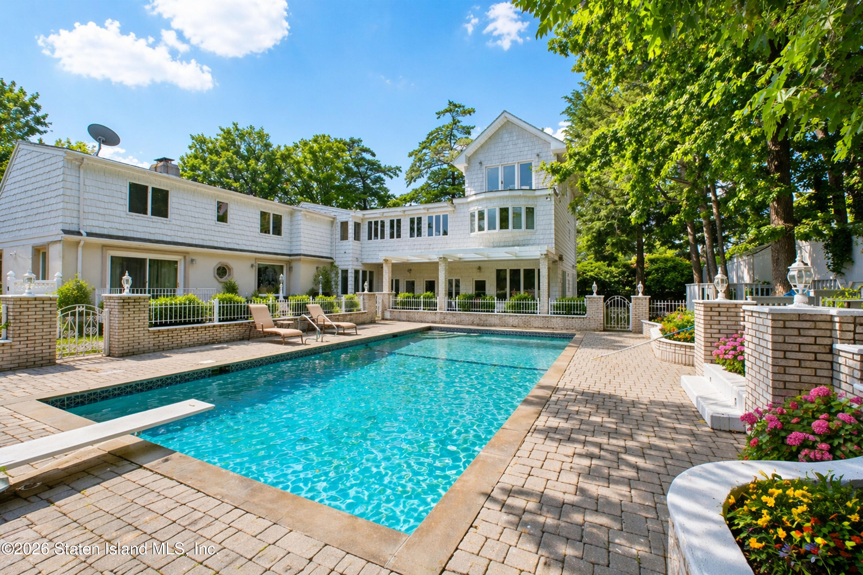 26 Highpoint Road Staten Island, NY 10304 - Photo 40 of 49 a view of a house with swimming pool and sitting area