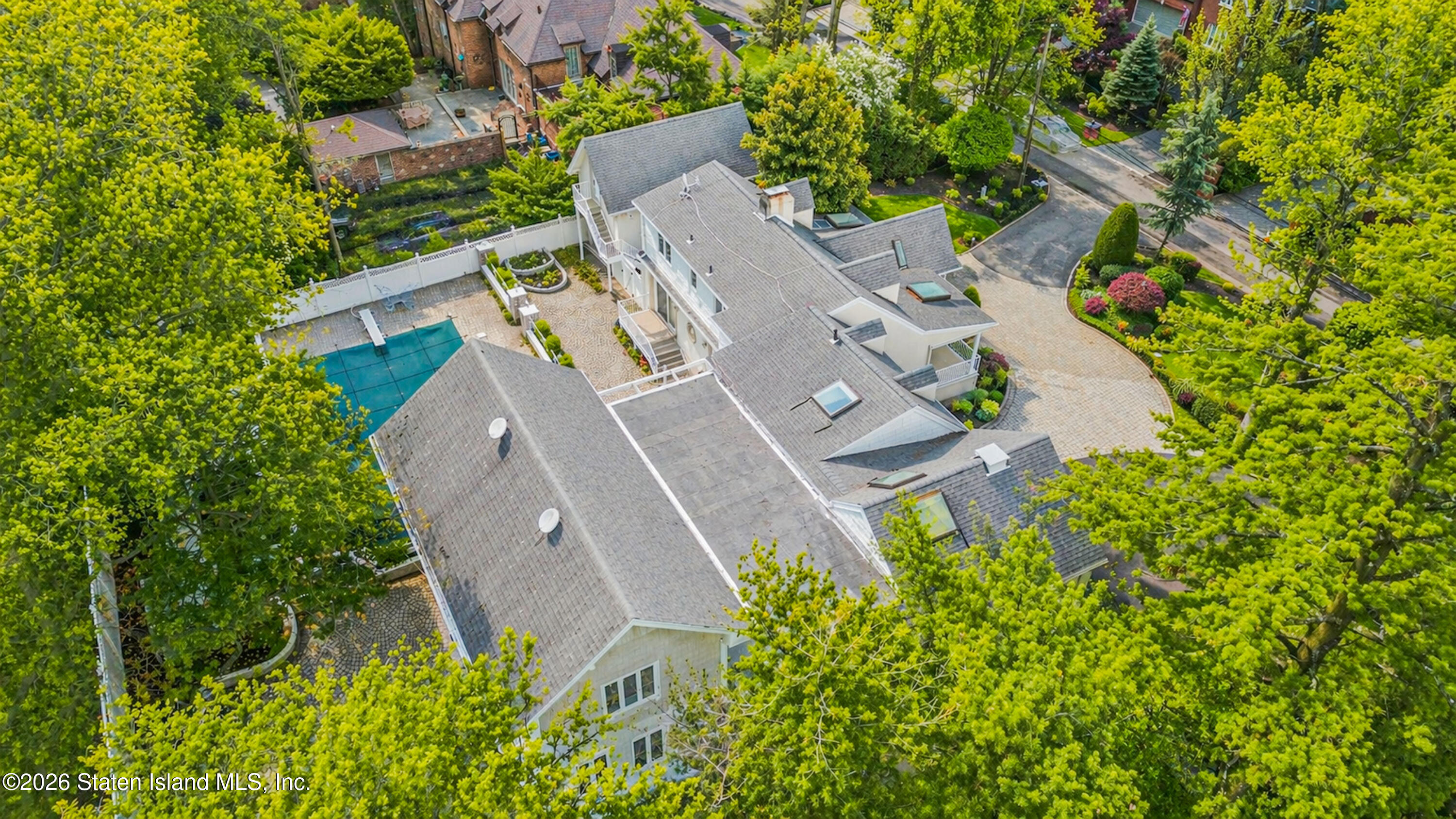 26 Highpoint Road Staten Island, NY 10304 - Photo 8 of 49 an aerial view of a house with a yard and a large tree