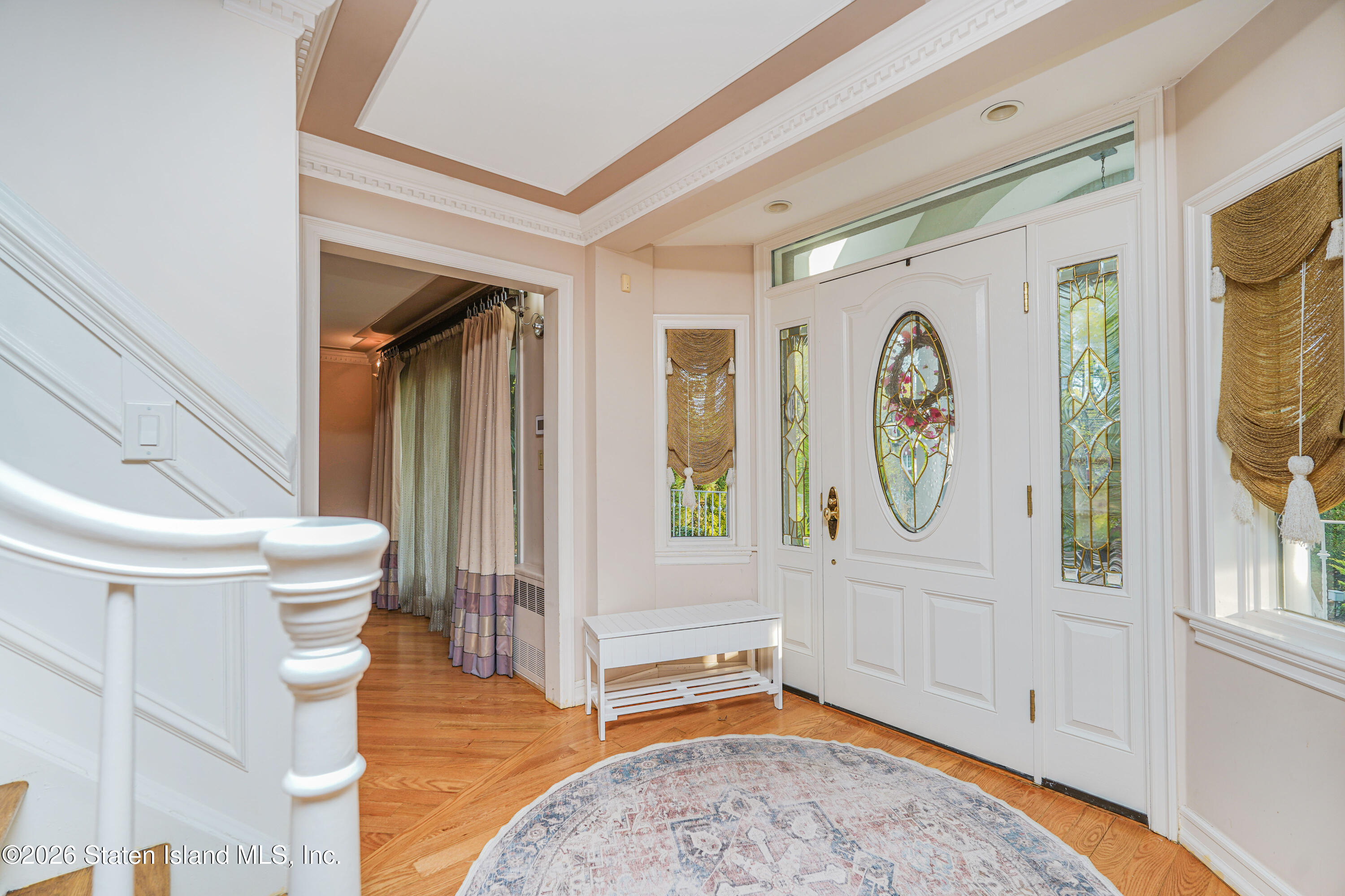 26 Highpoint Road Staten Island, NY 10304 - Photo 10 of 49 a living room with a baby crib furniture and a window