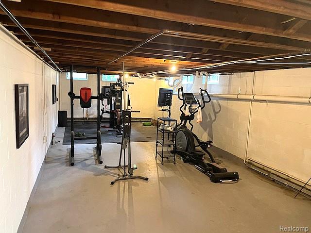 20285 29 Mile Road Ray, MI 48096 - Photo 19 of 25 Spacious lower level with exposed wood beam ceiling and painted concrete block walls