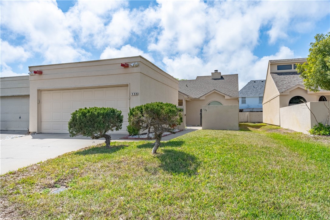 135 Santa Fe Rockport, TX 78382 - Photo 1 of 38 front view of house with a yard