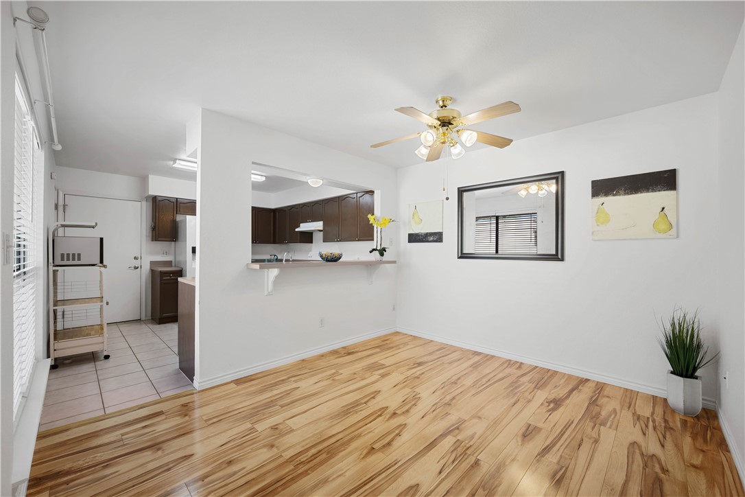 135 Santa Fe Rockport, TX 78382 - Photo 12 of 38 a bedroom with a bed and a chandelier