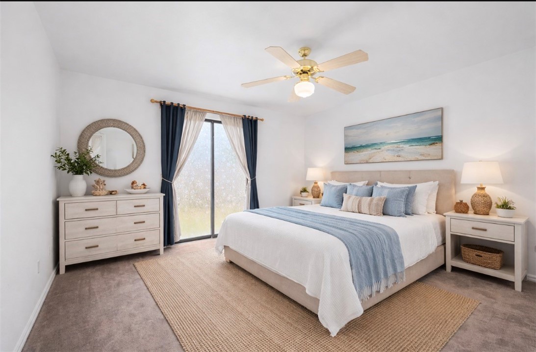 135 Santa Fe Rockport, TX 78382 - Photo 21 of 38 a bedroom with a bed and a chandelier