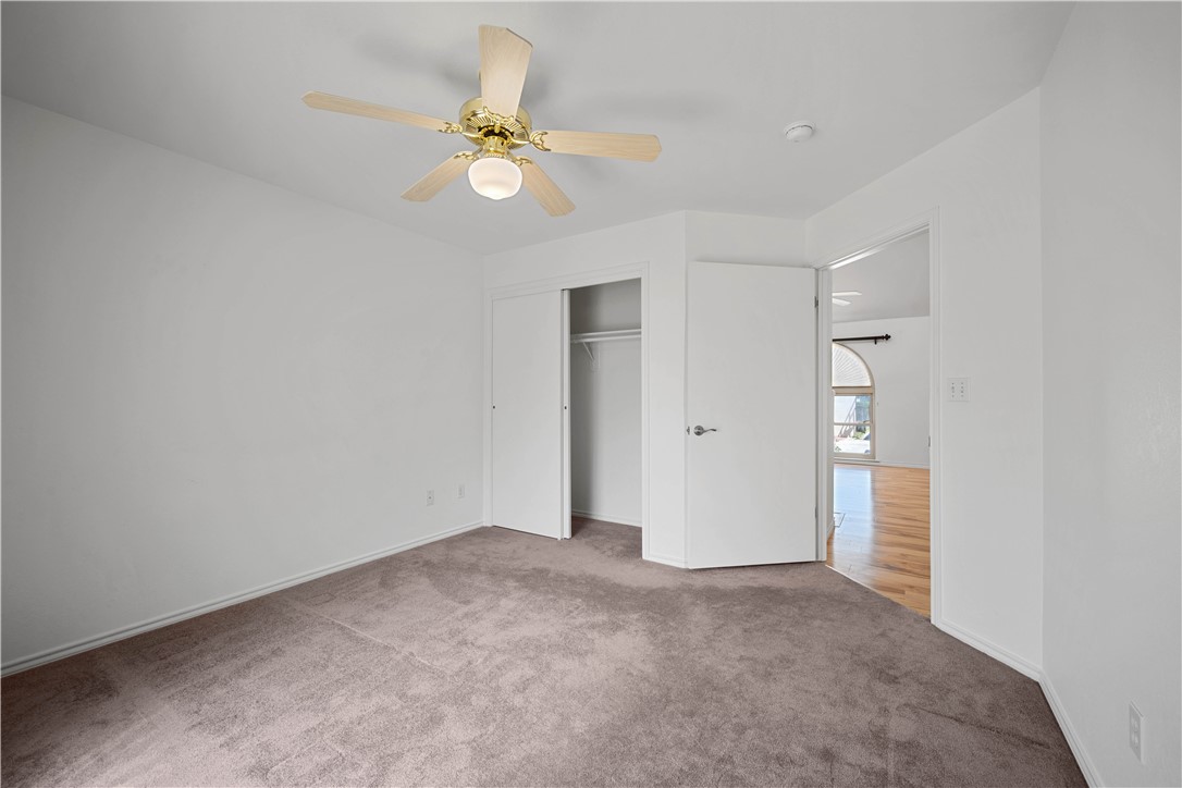 135 Santa Fe Rockport, TX 78382 - Photo 22 of 38 a view of an empty room and chandelier fan
