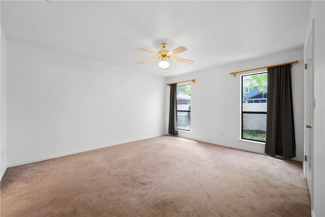 135 Santa Fe Rockport, TX 78382 - Photo 25 of 38 an empty room with closet and a ceiling fan