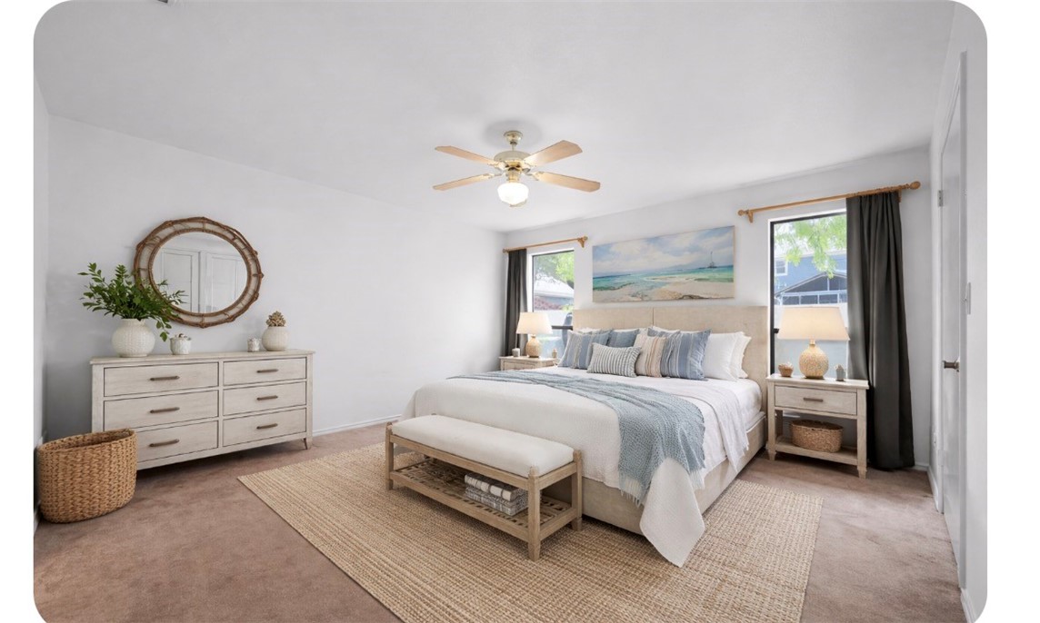 135 Santa Fe Rockport, TX 78382 - Photo 26 of 38 a bed room with a bed and a chandelier