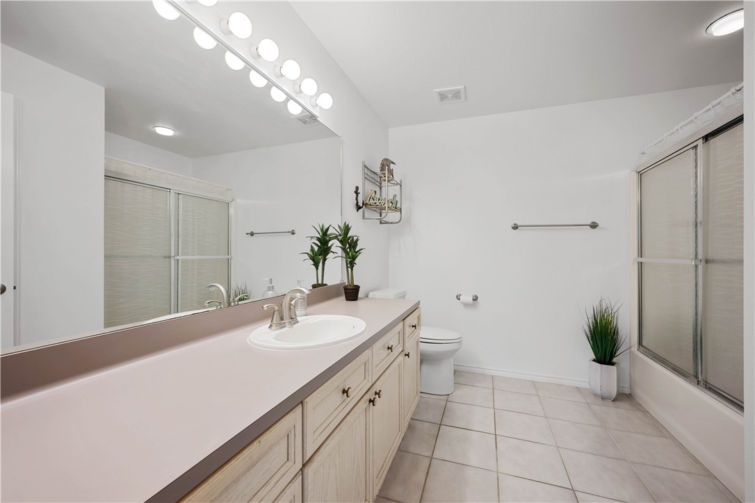 135 Santa Fe Rockport, TX 78382 - Photo 30 of 38 a bathroom with a sink a vanity and a mirror