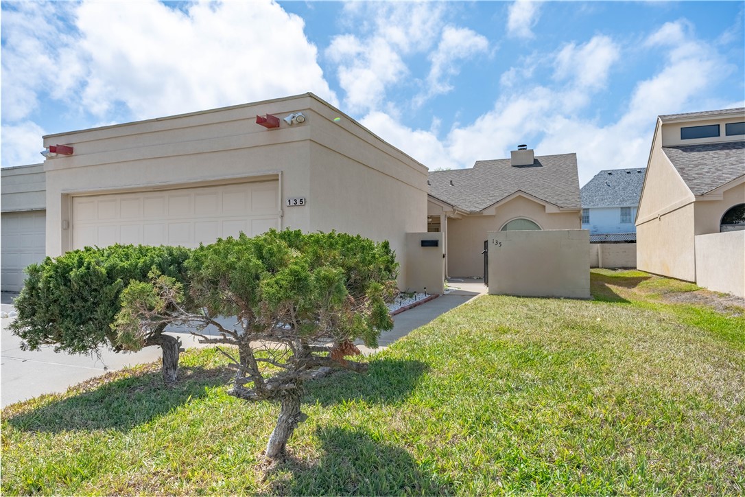 135 Santa Fe Rockport, TX 78382 - Photo 3 of 38 a house view with a backyard space