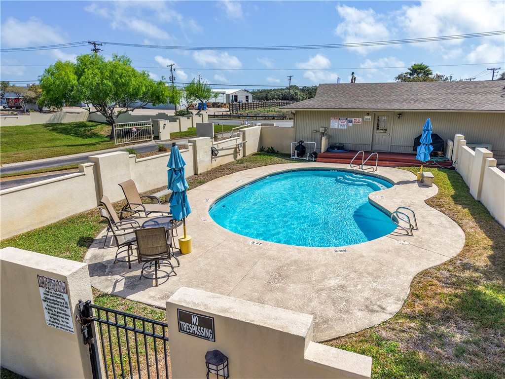 135 Santa Fe Rockport, TX 78382 - Photo 33 of 38 a view of a swimming pool with chairs
