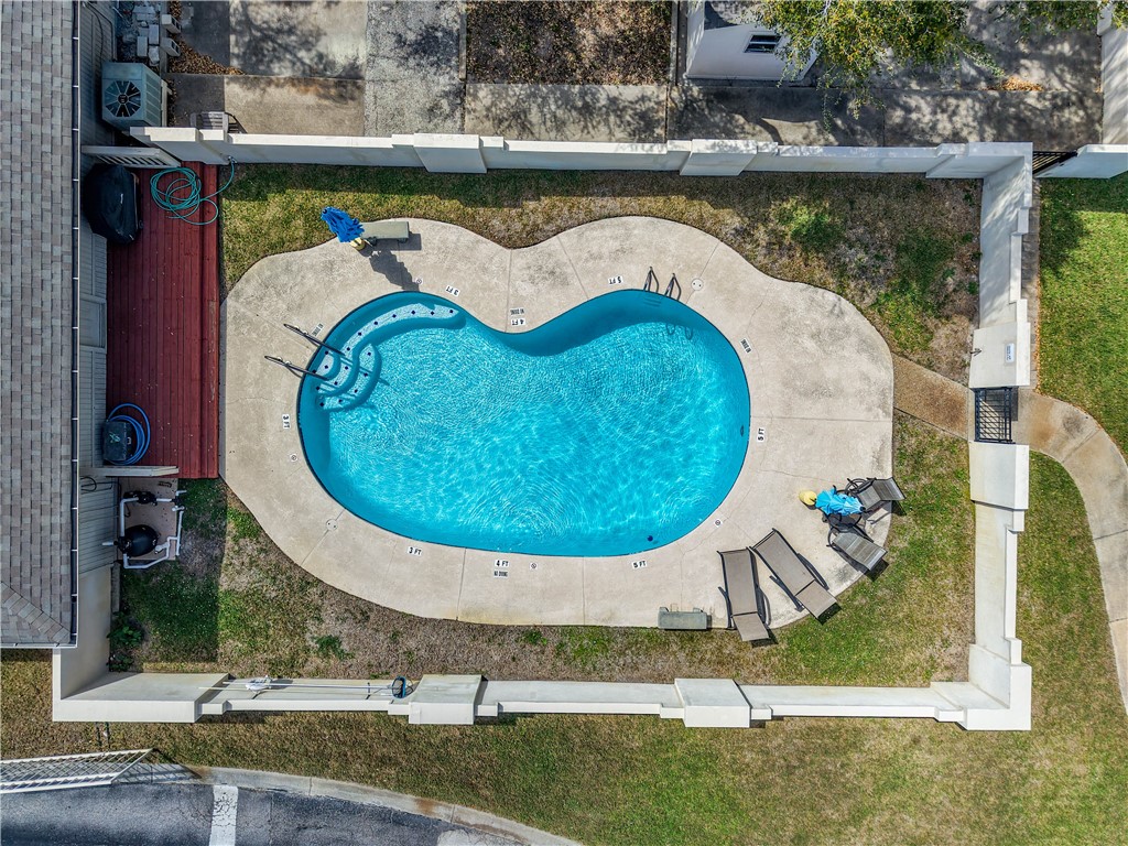 135 Santa Fe Rockport, TX 78382 - Photo 34 of 38 swimming pool view with a lake view