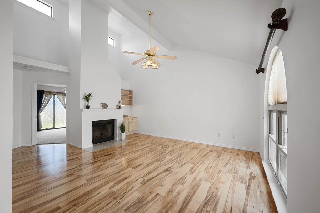 135 Santa Fe Rockport, TX 78382 - Photo 7 of 38 a view of empty room with wooden floor and fireplace