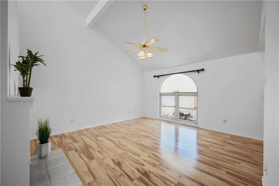 135 Santa Fe Rockport, TX 78382 - Photo 9 of 38 a view of a room with wooden floor and a ceiling fan