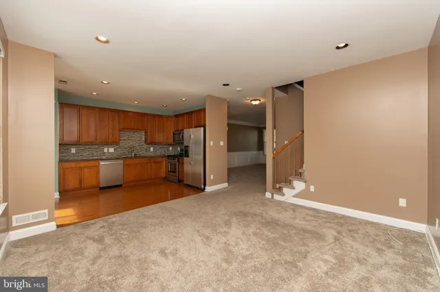 a view of a kitchen with a sink and cabinets