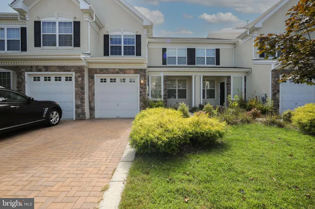 a front view of a building with garden