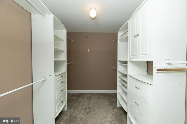 a kitchen with cabinets and a stove