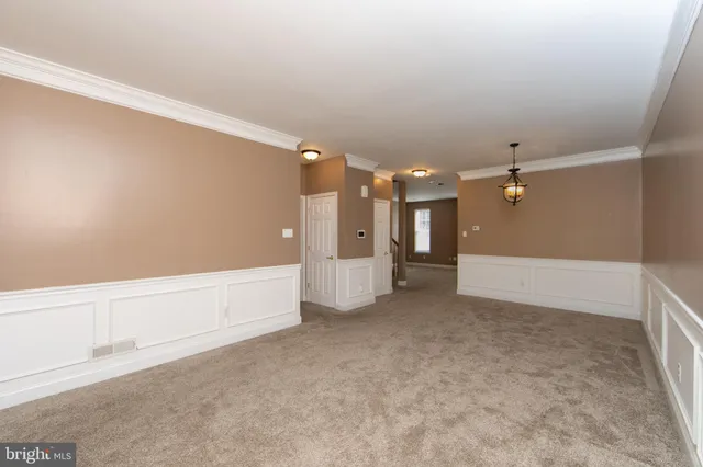 a view of a big room with an entryway