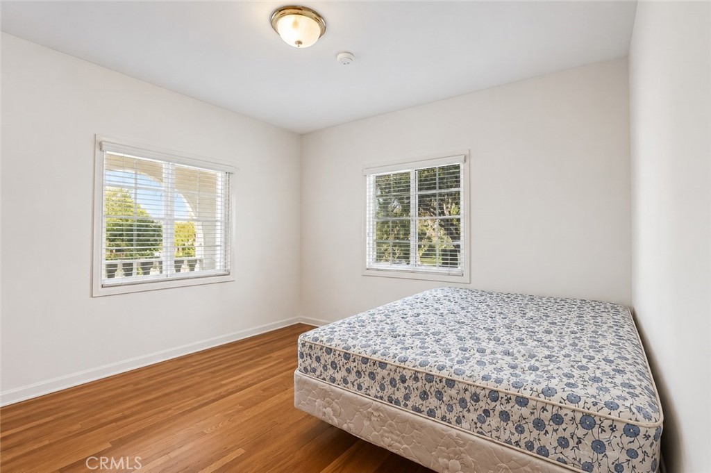 2209 Queensberry Road Pasadena, CA 91104 - Photo 19 of 44 a bedroom with a bed and a window
