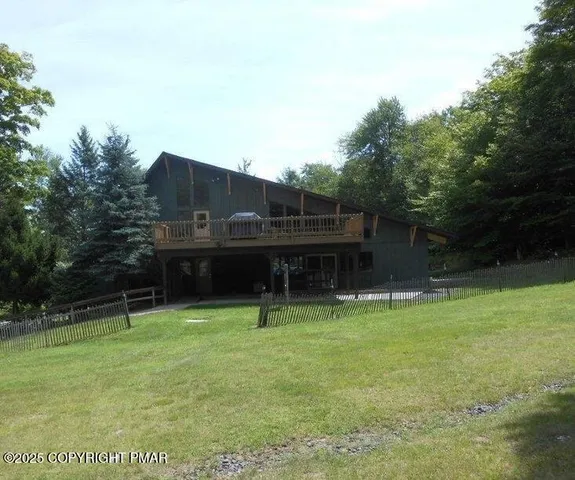 a table and chairs in front of a house