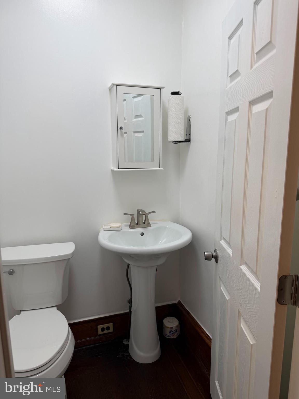 3141 North 7th Street Philadelphia, PA 19133 - Photo 5 of 15 a bathroom with a toilet a sink and mirror