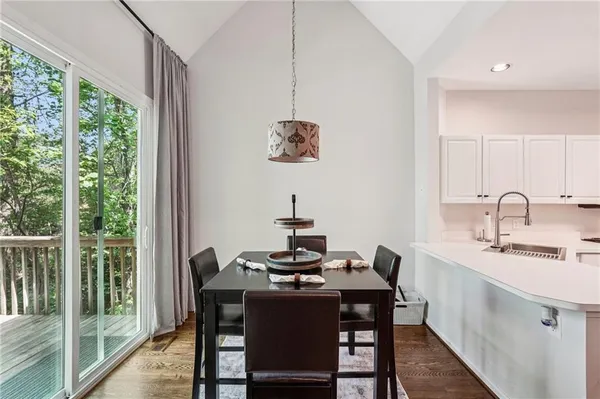 a dining room with furniture and window