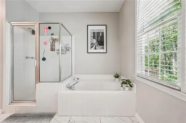 a white bath tub sitting next to a window