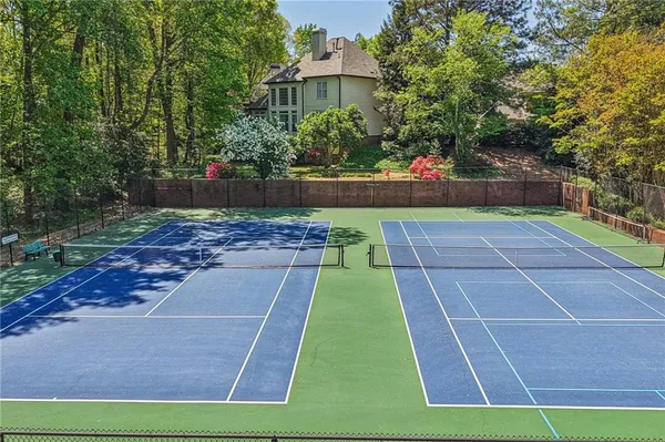 a swimming pool with outdoor seating and yard