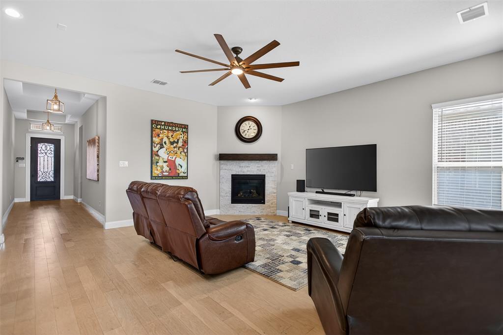 6829 Danridge Road Rowlett, TX 75089 - Photo 6 of 28 a living room with furniture and a flat screen tv