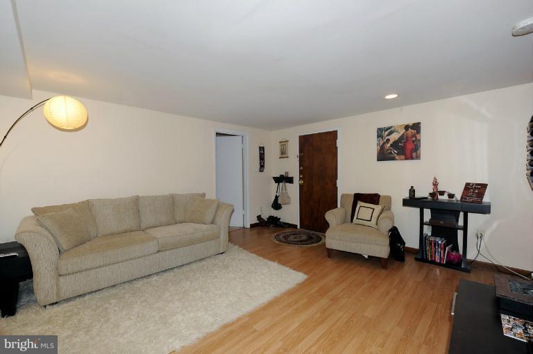 1514 17th Street Northwest, Unit 14 Washington, DC 20036 - Photo 3 of 16 a living room with furniture and a wooden floor