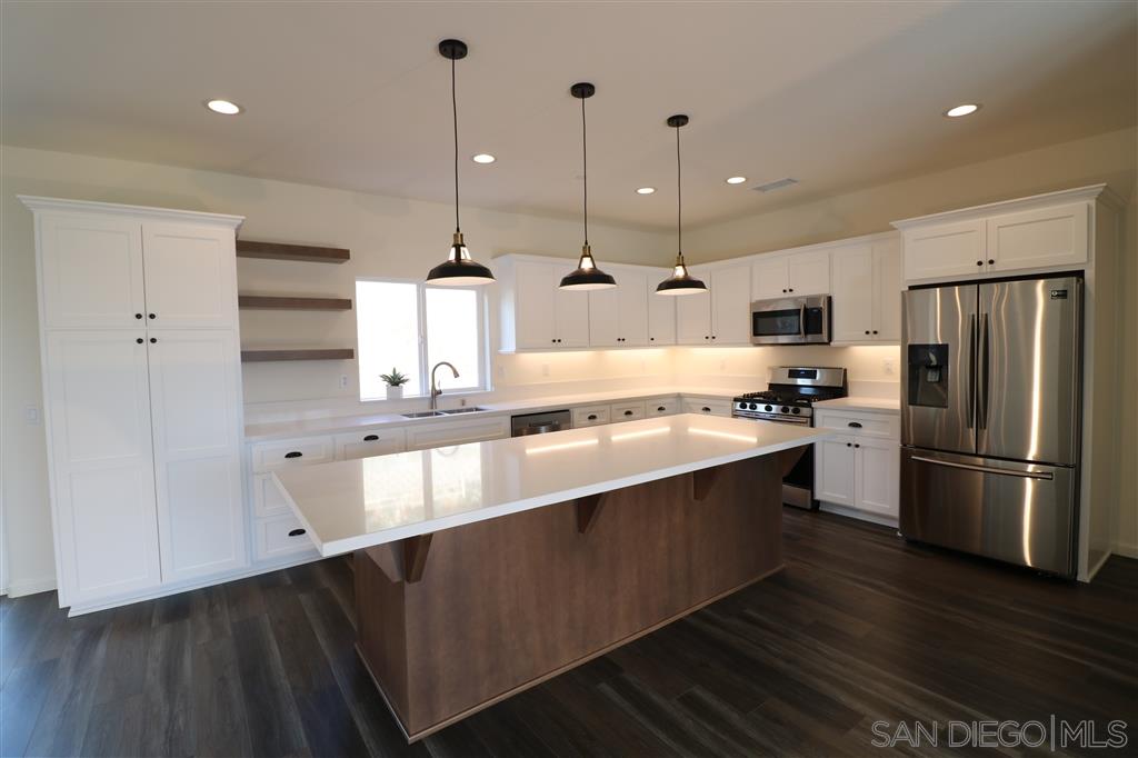1424 Mountain View Road El Cajon, CA 92021 - Photo 1 of 17 Gorgeous kitchen with quartz counters and stainless steel appliances