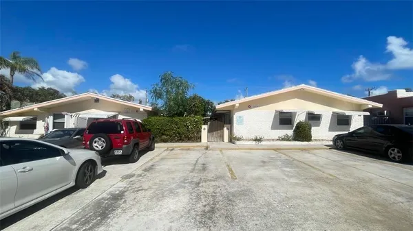 a view of a car in front of a house