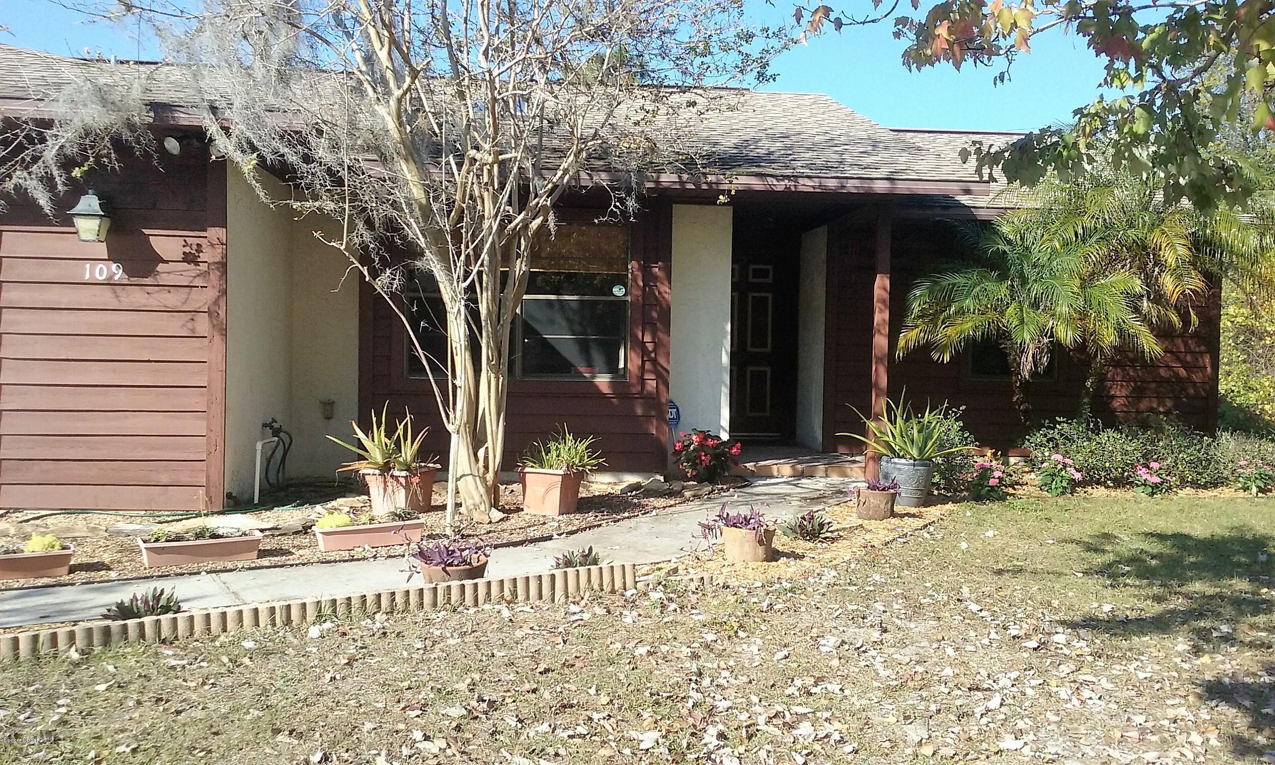 109 Tudor Road Southwest Palm Bay, FL 32908 - Photo 1 of 15 a view of a house with street