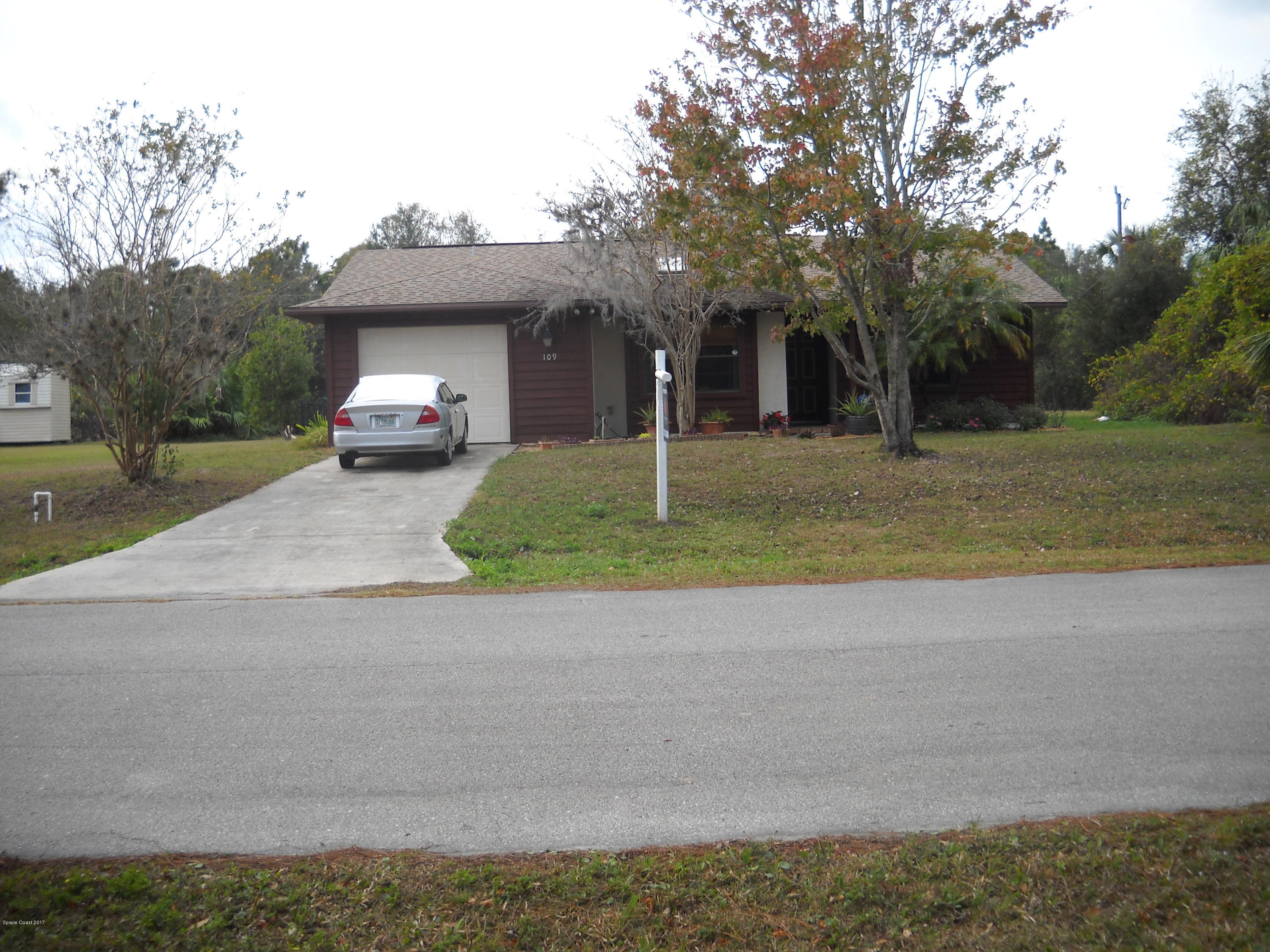 109 Tudor Road Southwest Palm Bay, FL 32908 - Photo 4 of 15 a view of a house with a outdoor space