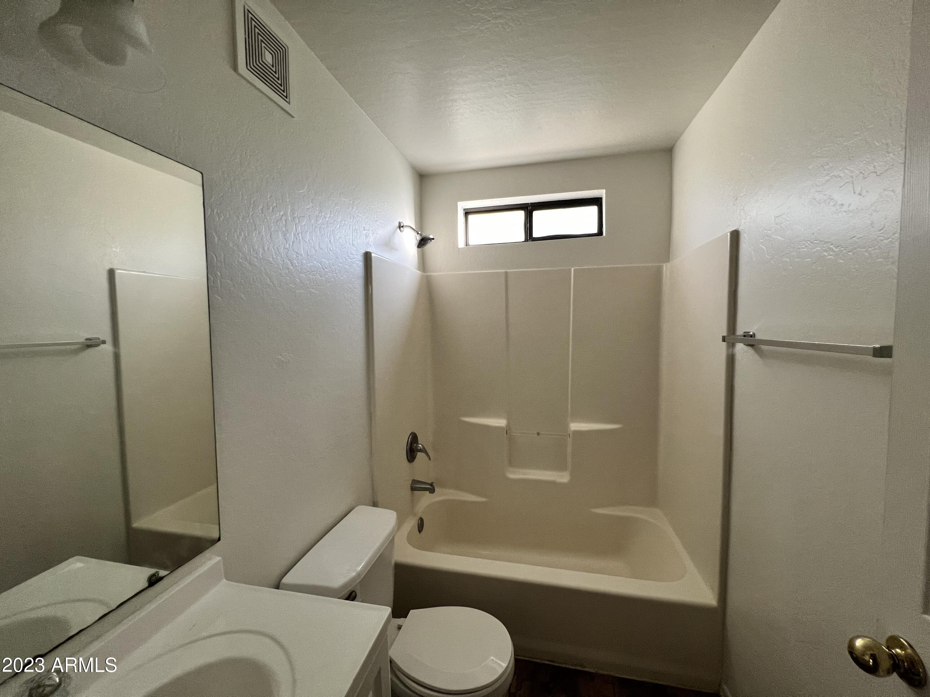 1287 North Alma School Road, Unit 224 Chandler, AZ 85224 - Photo 7 of 8 a bathroom with a sink toilet and shower