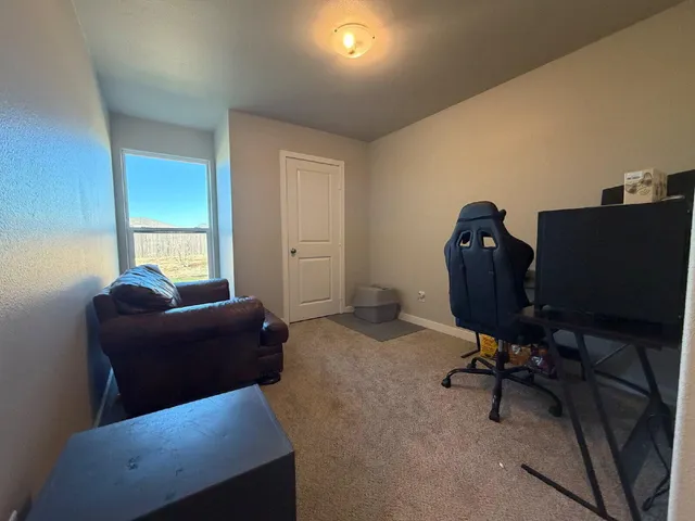 a workspace with furniture and a gate