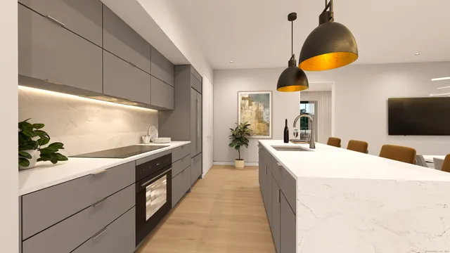 a kitchen with stainless steel appliances a stove a chimney a sink and a dining table