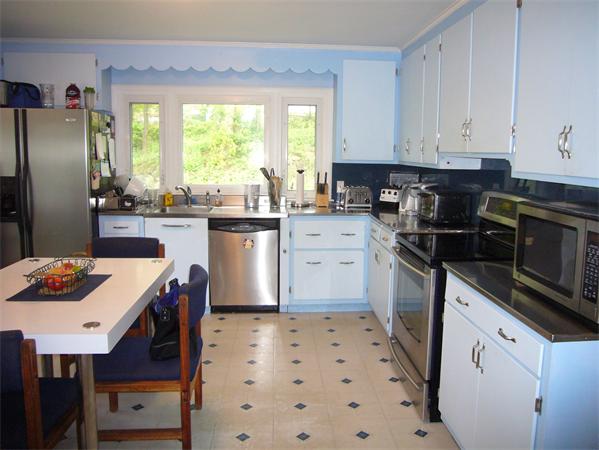 7 Zenith Drive Worcester, MA 01602 - Photo 12 of 13 a kitchen with a sink a stove a refrigerator and cabinets