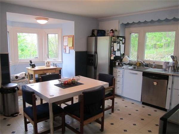 7 Zenith Drive Worcester, MA 01602 - Photo 13 of 13 a kitchen with stainless steel appliances granite countertop a dining table chairs refrigerator and sink
