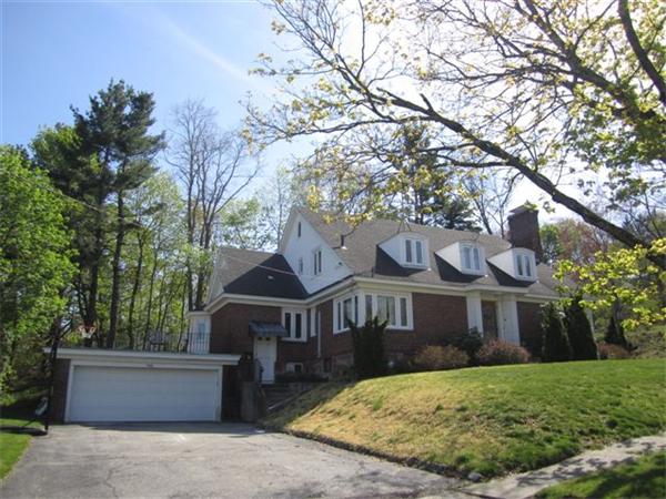 7 Zenith Drive Worcester, MA 01602 - Photo 2 of 13 a front view of a house with a garden